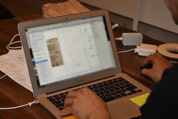 KJ btrax's designer and developer working on a prototype during a design sprint for our client