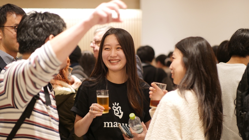 Attendees networking at the Manus Event